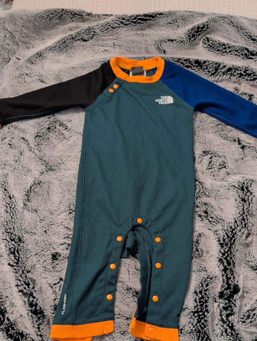 The North Face Teal Waffle Footie with Orange Trim and Contrast Sleeves Baby